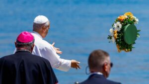 Pope Leo XIV makes a floral offering to migrants lost at sea at the dock of the Port of Arguineguin in Gran Canaria, Spain, June 11, 2026, part of his June 6-12 apostolic journey to Spain. (OSV News photo/Borja Suarez, Reuters)